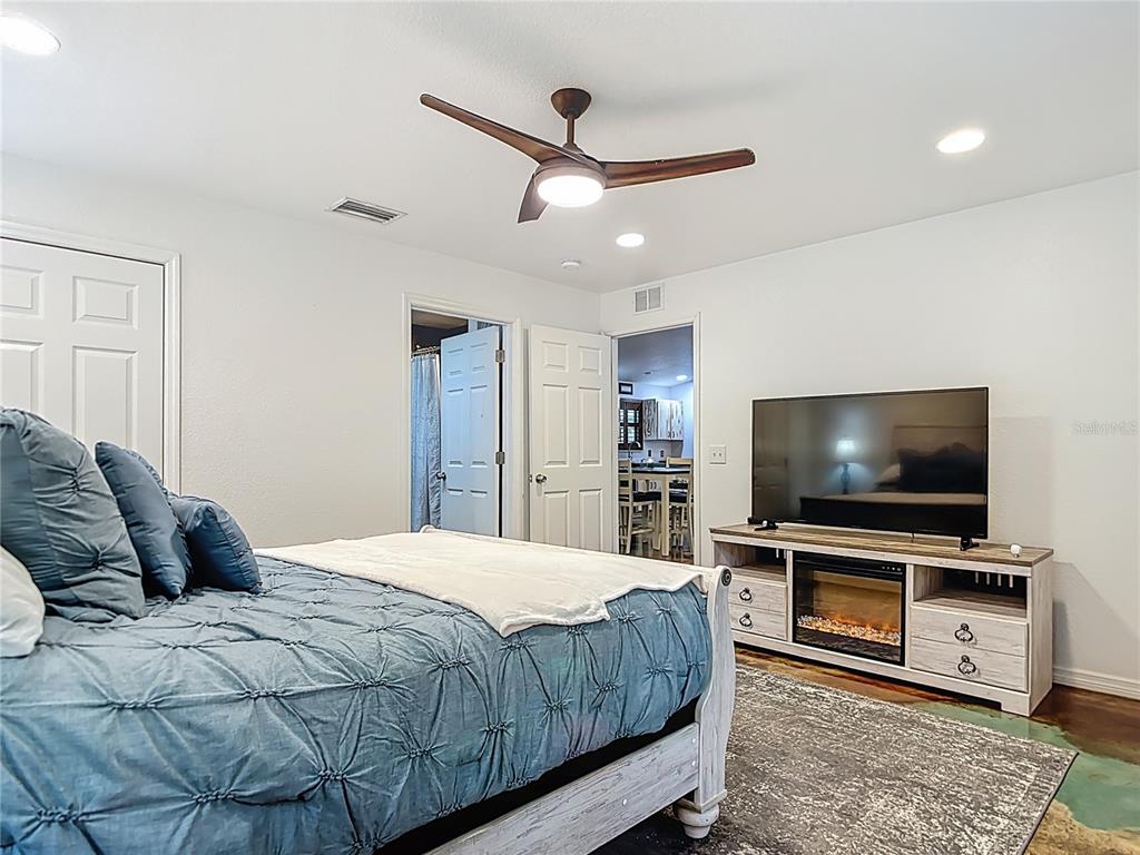 3114 Southeast Brown Road Arcadia, FL 34266 - Photo 26 of 61 a bedroom with a bed and a flat screen tv