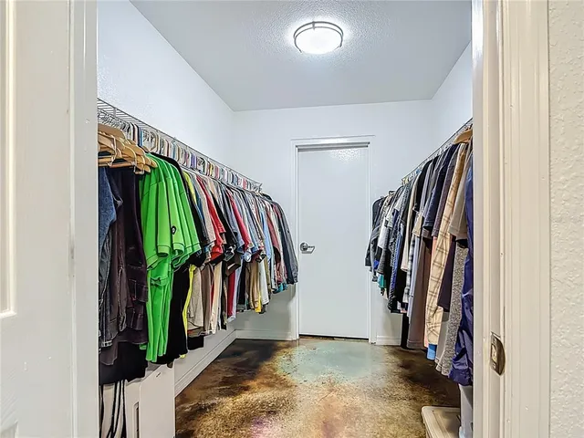 a room with gym equipment and a view of living room