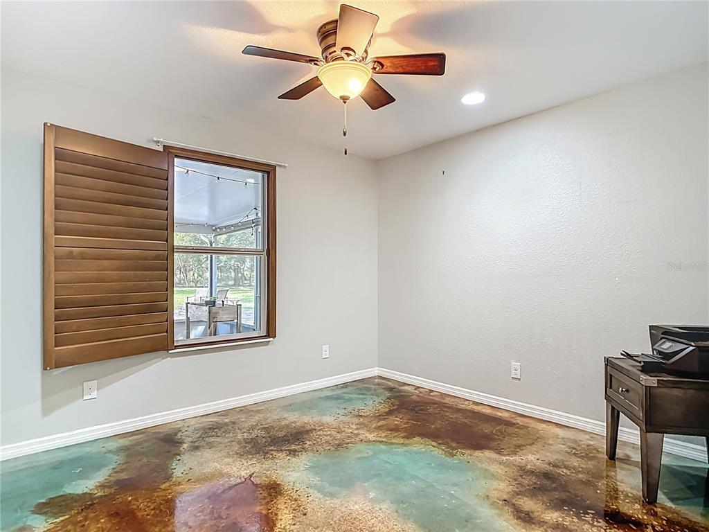 3114 Southeast Brown Road Arcadia, FL 34266 - Photo 31 of 61 a view of a livingroom with a ceiling fan and window