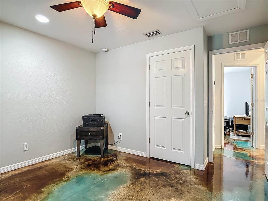 3114 Southeast Brown Road Arcadia, FL 34266 - Photo 32 of 61 a room with gym equipment and a view of living room
