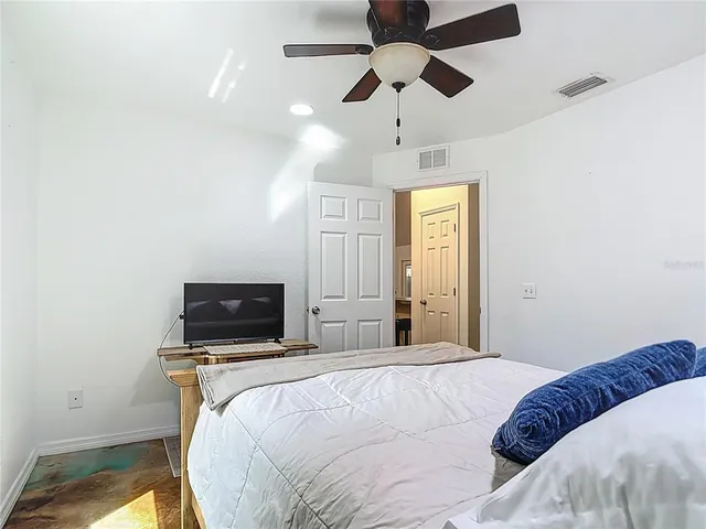 a view of a house with backyard and porch