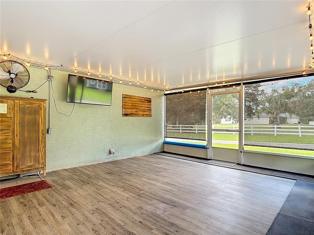 3114 Southeast Brown Road Arcadia, FL 34266 - Photo 38 of 61 a view of a room with wooden floor and windows
