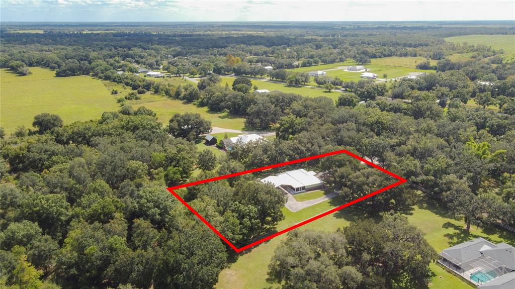3114 Southeast Brown Road Arcadia, FL 34266 - Photo 4 of 61 an aerial view of residential houses with outdoor space and lakeside