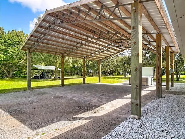a view of a park with large trees