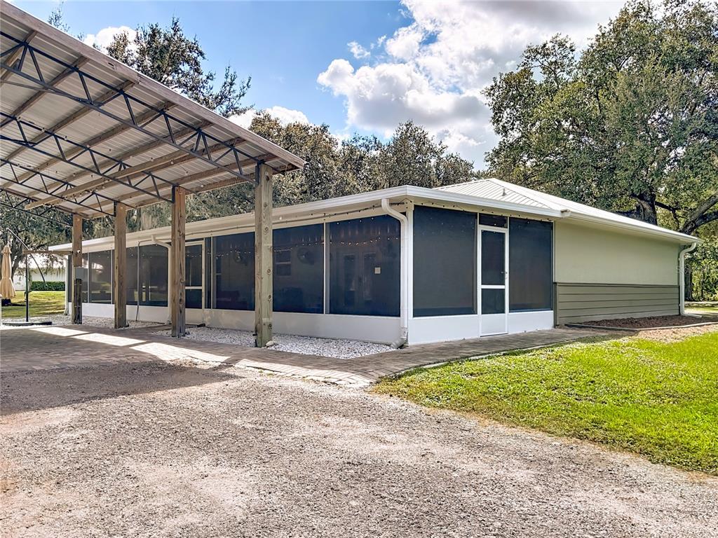 3114 Southeast Brown Road Arcadia, FL 34266 - Photo 46 of 61 a front view of a house with a yard and garage