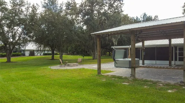 a view of a yard with a lake view