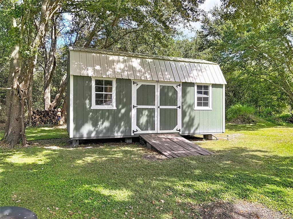 3114 Southeast Brown Road Arcadia, FL 34266 - Photo 58 of 61 a view of a house with backyard and garden