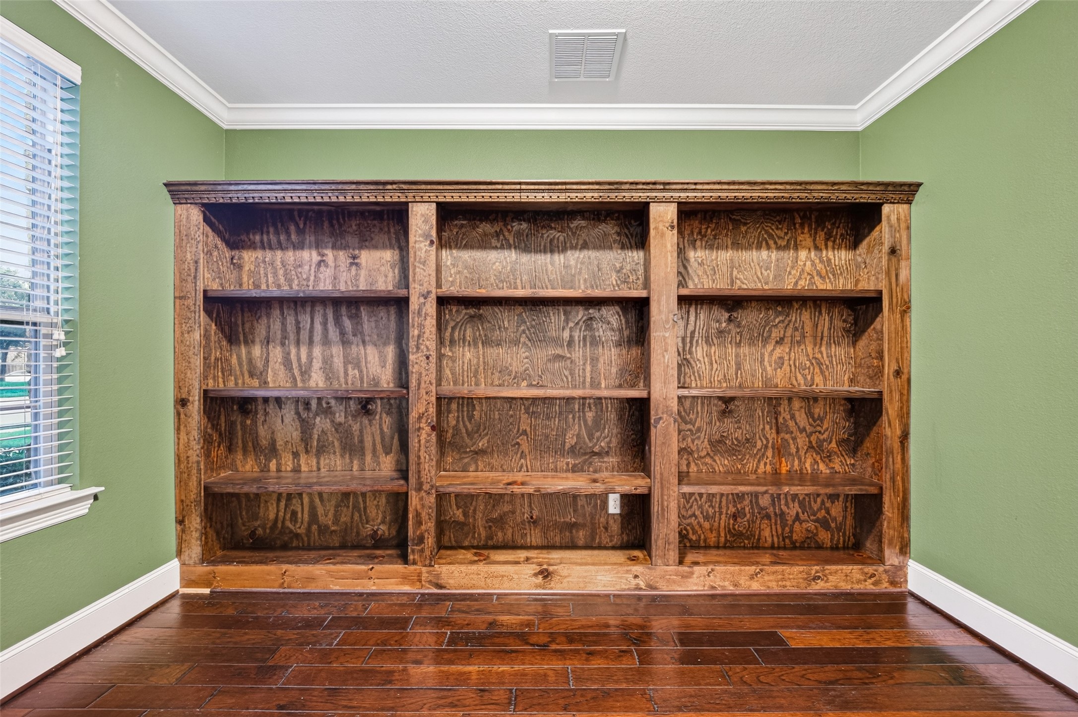 7930 Summer Night Lane Rosenberg, TX 77469 - Photo 6 of 48 Private home office featuring crown molding, and custom built-in bookshelves.