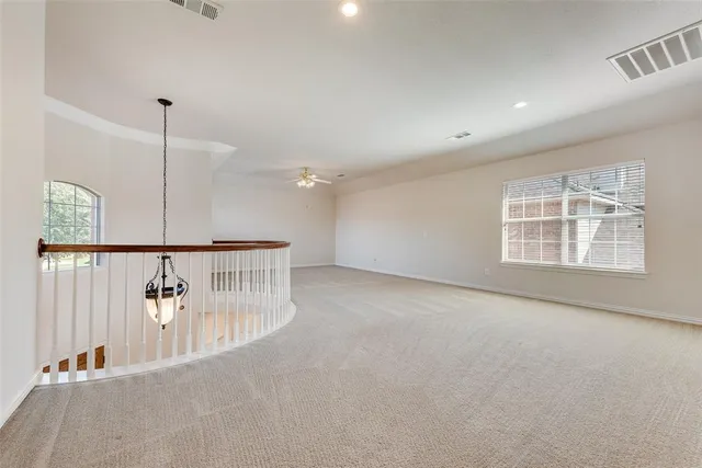 a view of a hallway with windows