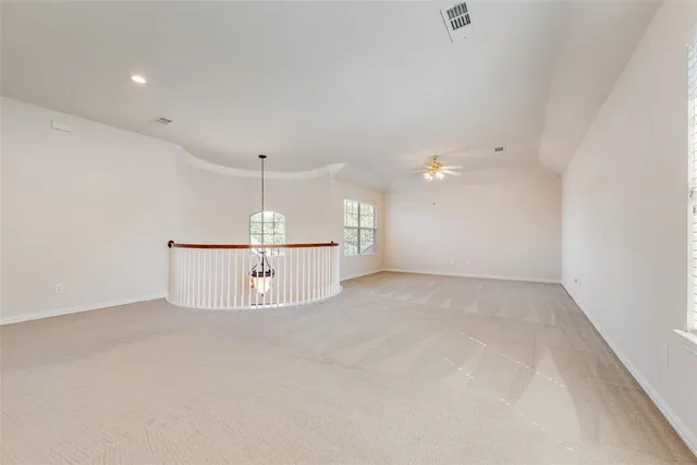a view of a utility room with a ceiling fan