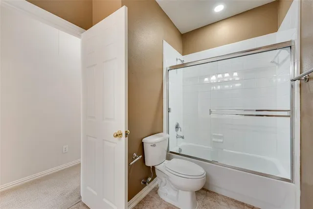 a bathroom with a shower and a toilet