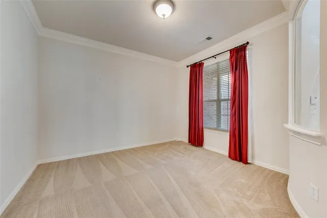 a view of a room with blue walls and a window