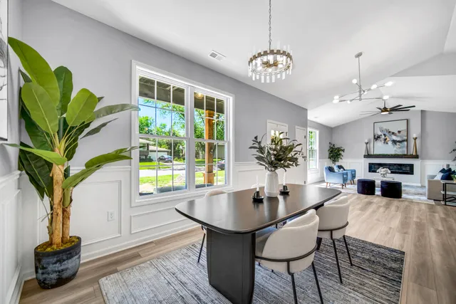 a view of a dining room with furniture window and wooden floor