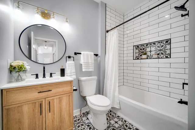 a bathroom with a toilet a sink and a bathtub