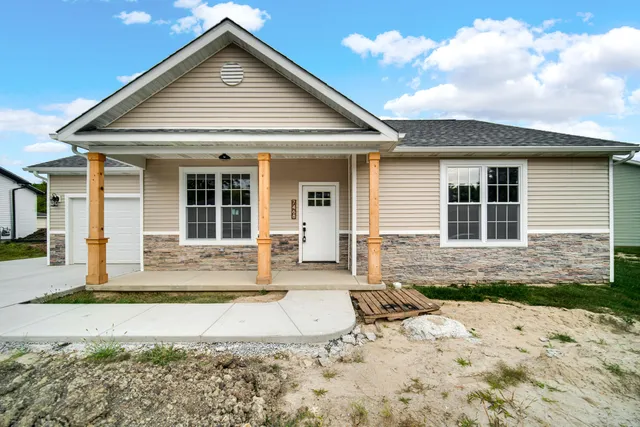 a front view of a house with a patio