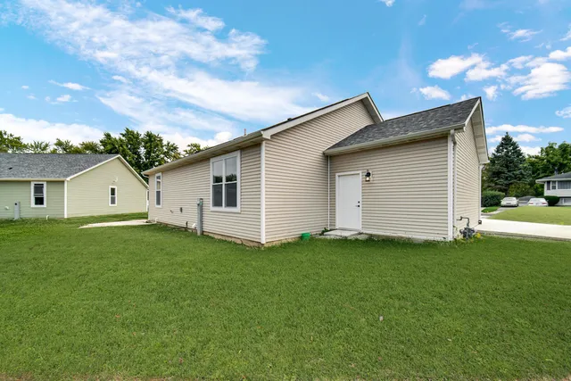 a view of a backyard of the house