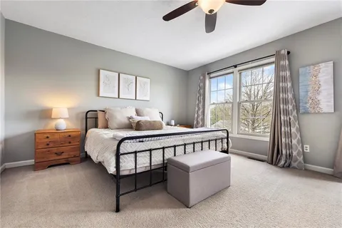 a bedroom with furniture and a window