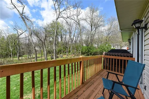 a view of a two chairs in the deck