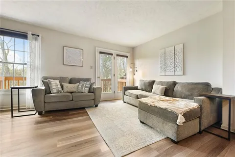 a living room with a couch and a window