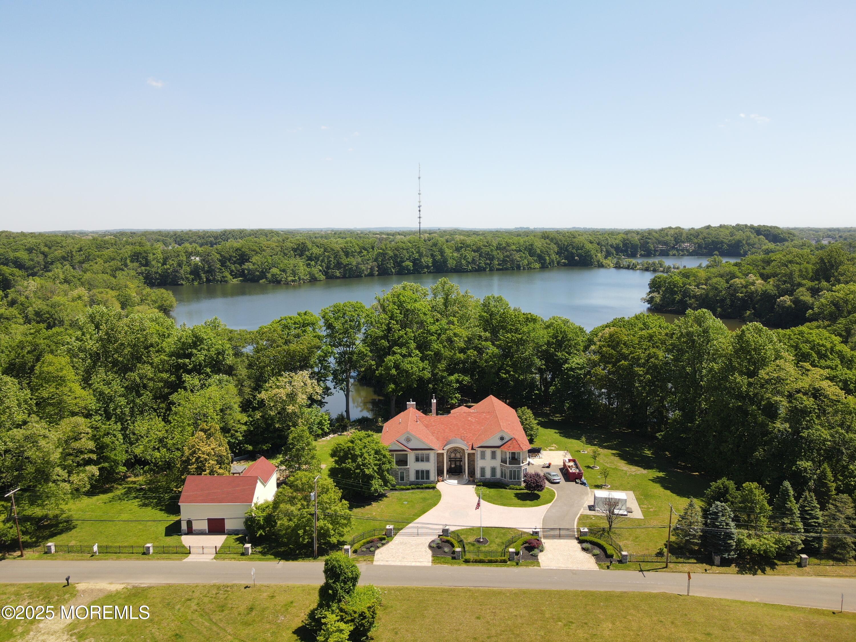 100 Richdale Road Colts Neck, NJ 07722 - Photo 30 of 31 an aerial view of a house with garden space and lake view