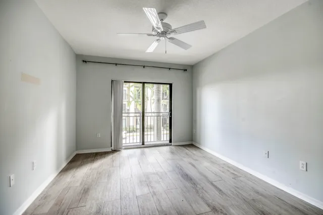 a bathroom with a double vanity sink toilet mirror and shower