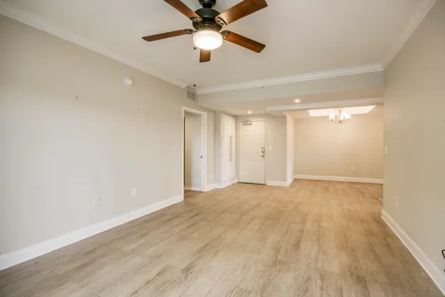 a view of a kitchen with a sink cabinets and wooden floor