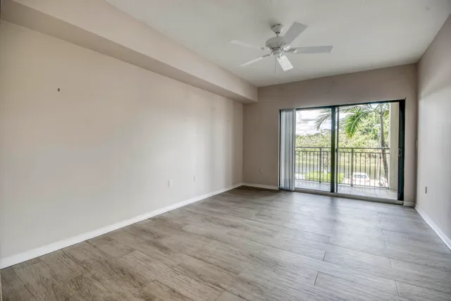 a bathroom with a granite countertop double vanity sink and a mirror