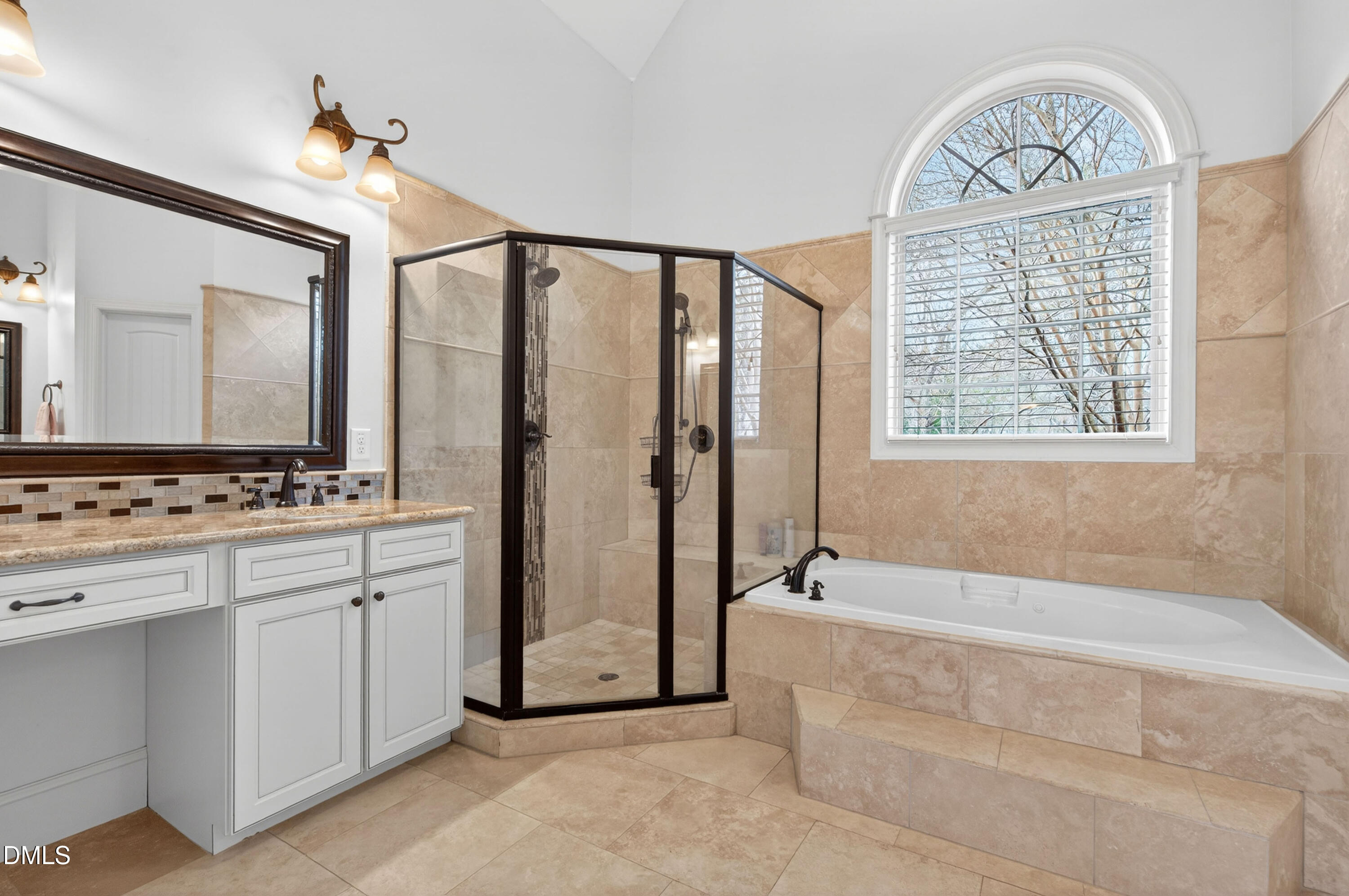 691 Hawthorne Place Creedmoor, NC 27522 - Photo 38 of 84 a spacious bathroom with a granite countertop tub sink and mirror