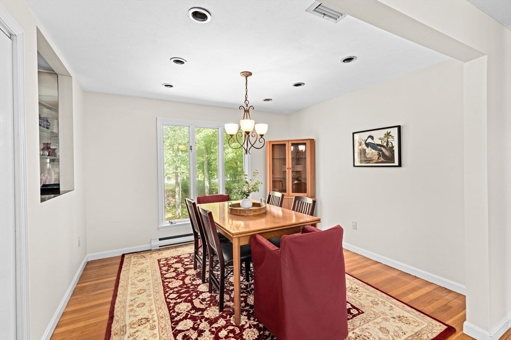 131 Cross Street Norwell, MA 02061 - Photo 13 of 41 a view of a dining room with furniture window and wooden floor