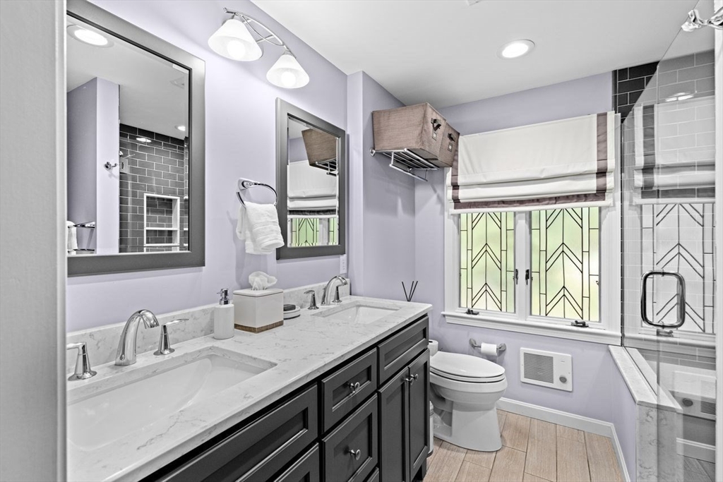 131 Cross Street Norwell, MA 02061 - Photo 17 of 41 a bathroom with a granite countertop sink mirror vanity and a toilet