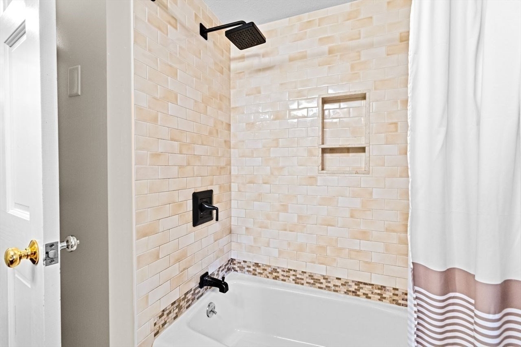 131 Cross Street Norwell, MA 02061 - Photo 24 of 41 a bathroom with a bathtub and shower