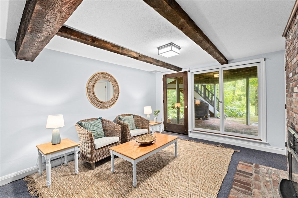 131 Cross Street Norwell, MA 02061 - Photo 28 of 41 a living room with furniture a table and a large window