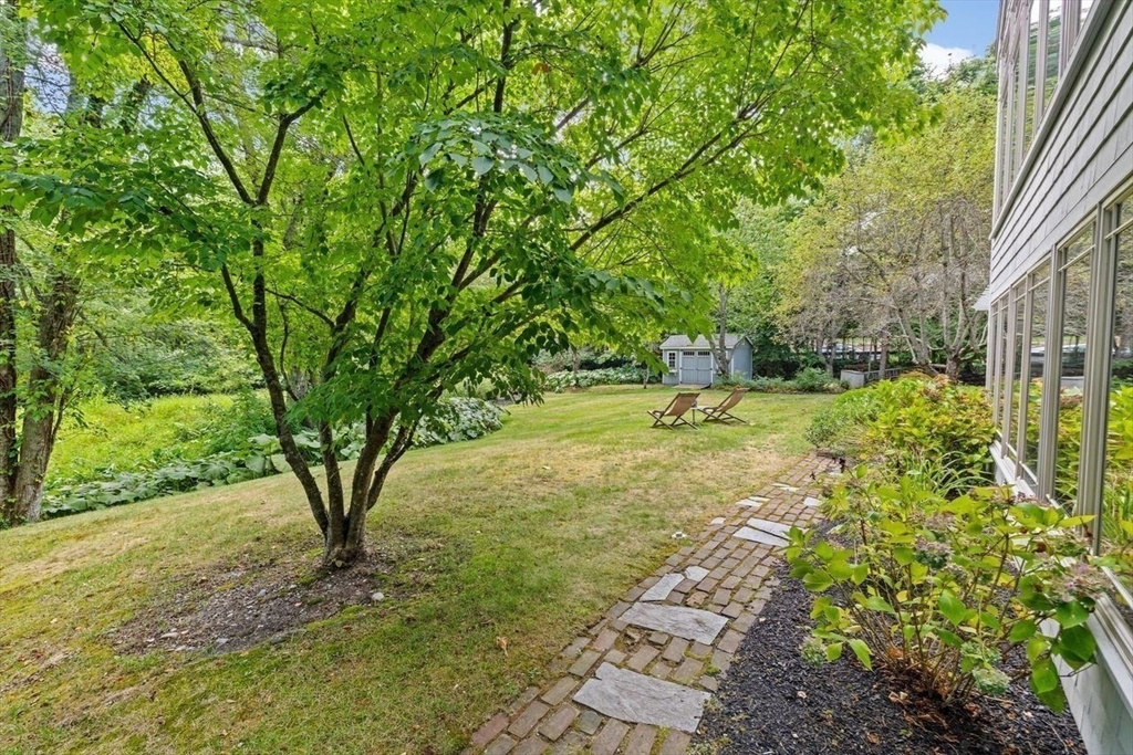 131 Cross Street Norwell, MA 02061 - Photo 35 of 41 a backyard of a house with large trees