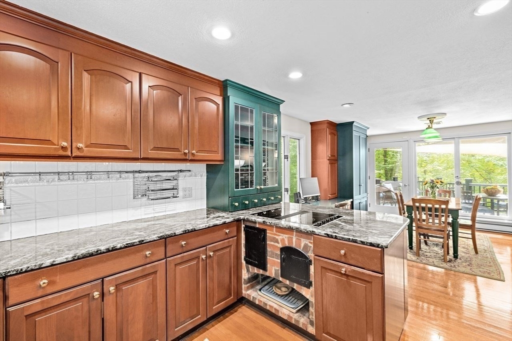131 Cross Street Norwell, MA 02061 - Photo 8 of 41 a open kitchen with granite countertop a sink dishwasher stove and cabinets