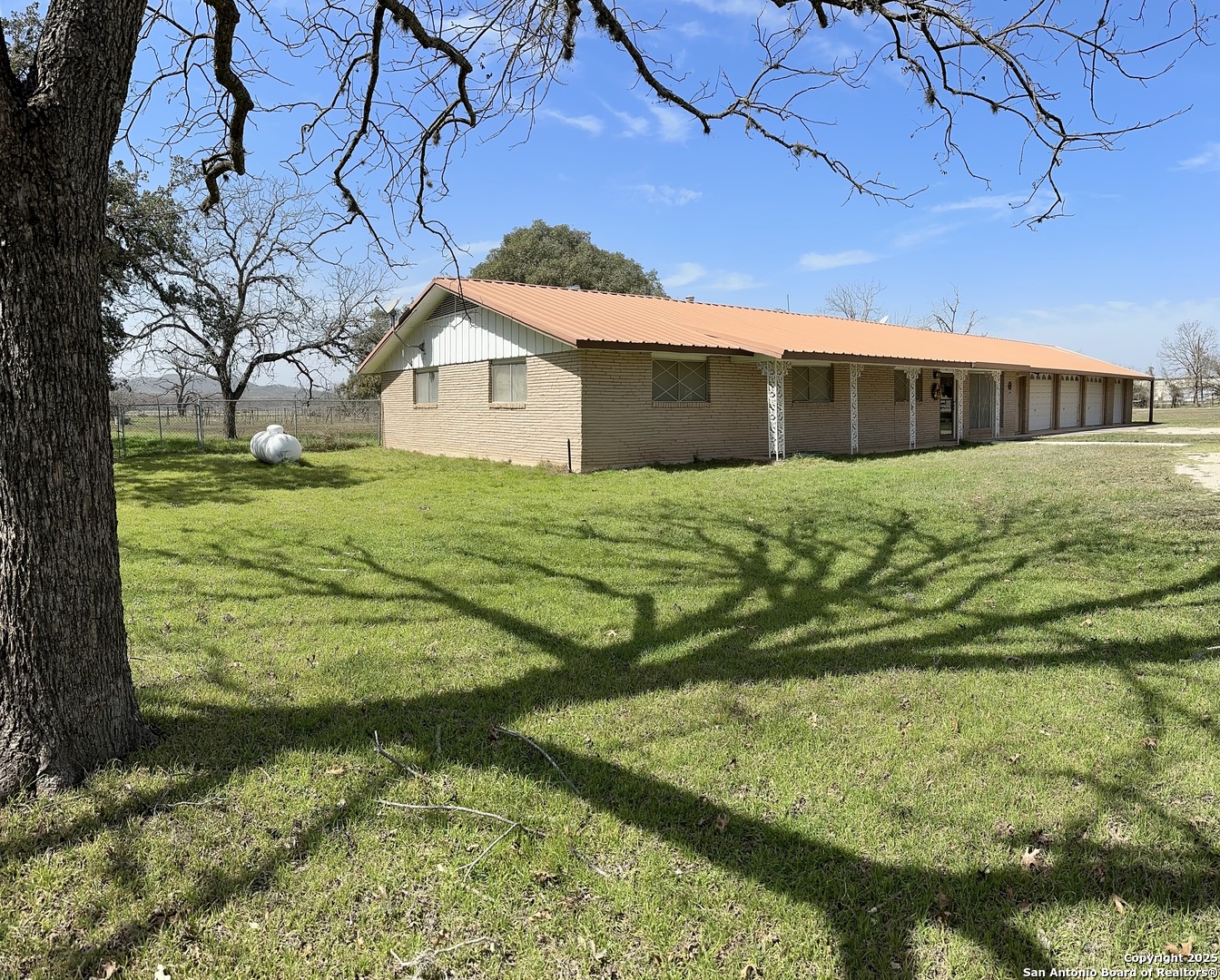 779 Main Street Utopia, TX 78884 - Photo 3 of 22 a front view of a house with a yard