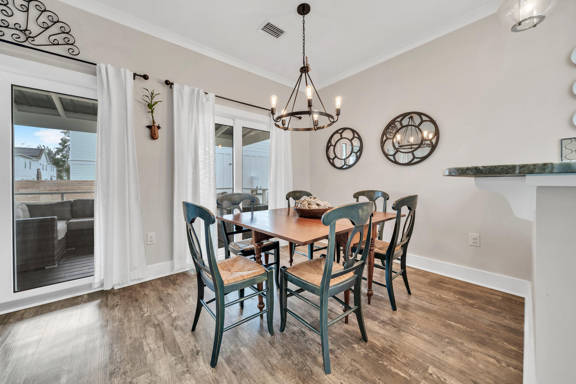 271 Rearden Way Santa Rosa Beach, FL 32459 - Photo 7 of 34 a view of a dining room with furniture window and wooden floor