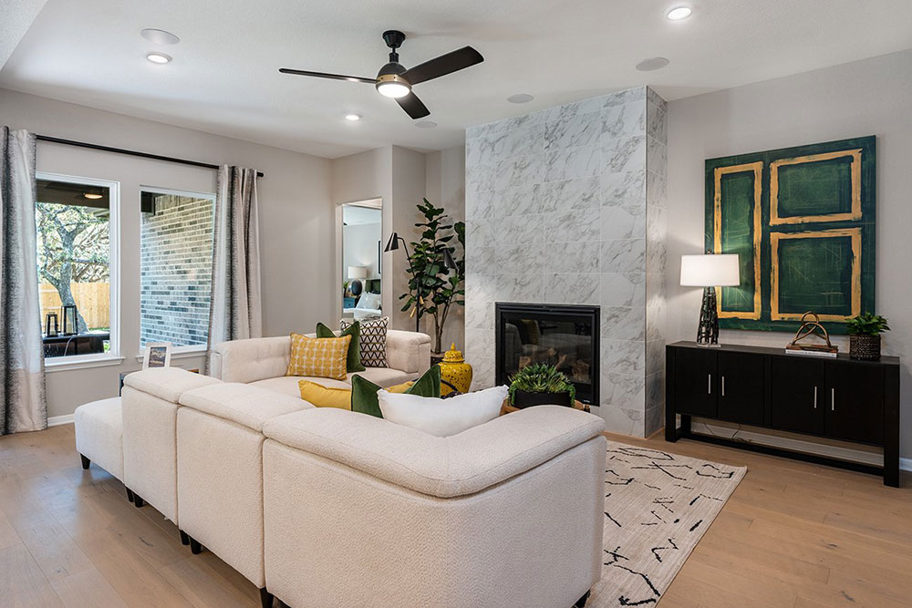 1212 Scenic Grn Loop Georgetown, TX 78628 - Photo 25 of 36 a living room with furniture and a fireplace