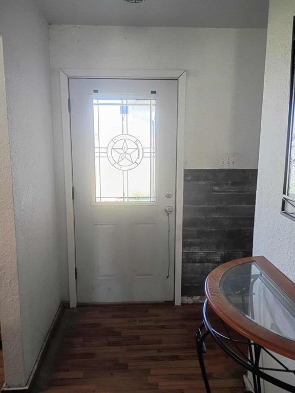 634 East Eubank Street Mabank, TX 75147 - Photo 12 of 40 a room with wooden floor and furniture