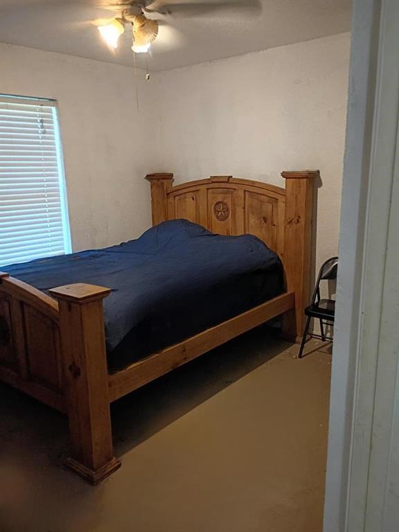 634 East Eubank Street Mabank, TX 75147 - Photo 16 of 40 a bedroom with a bed and window