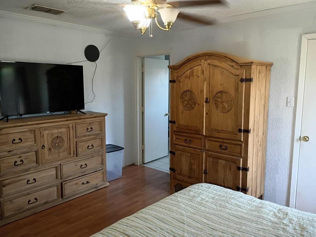 634 East Eubank Street Mabank, TX 75147 - Photo 18 of 40 a bedroom with a bed and furniture