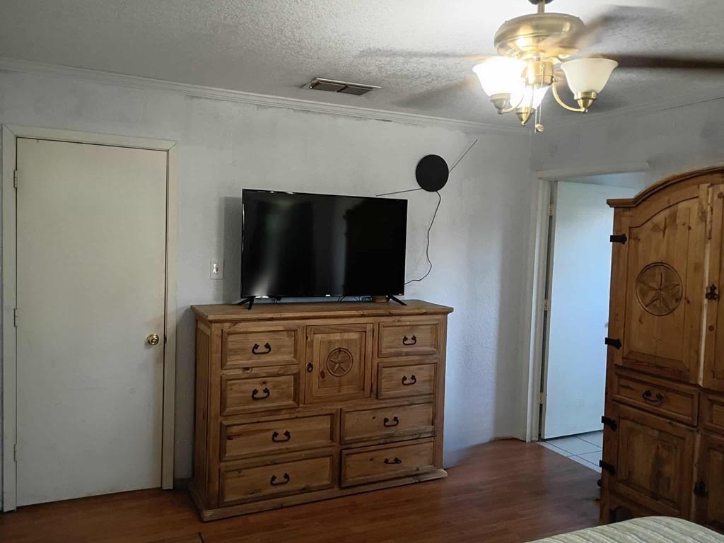 634 East Eubank Street Mabank, TX 75147 - Photo 21 of 40 a living room with furniture and a flat screen tv