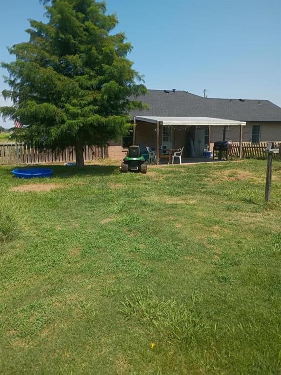 634 East Eubank Street Mabank, TX 75147 - Photo 30 of 40 a front view of a house with a garden