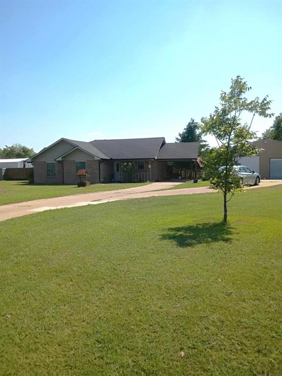634 East Eubank Street Mabank, TX 75147 - Photo 3 of 40 a view of a big yard with a house