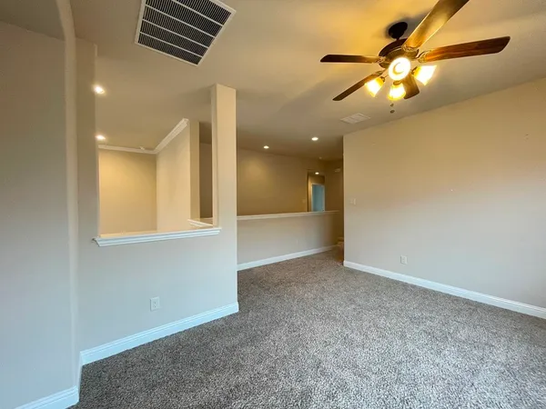 a view of hallway with windows