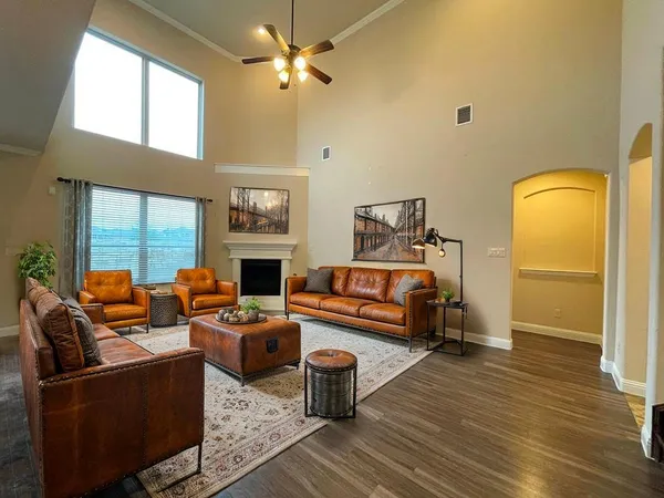 a bedroom with furniture and a fireplace