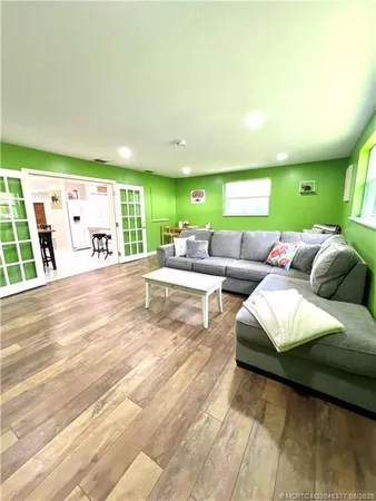 a living room with furniture and a large window