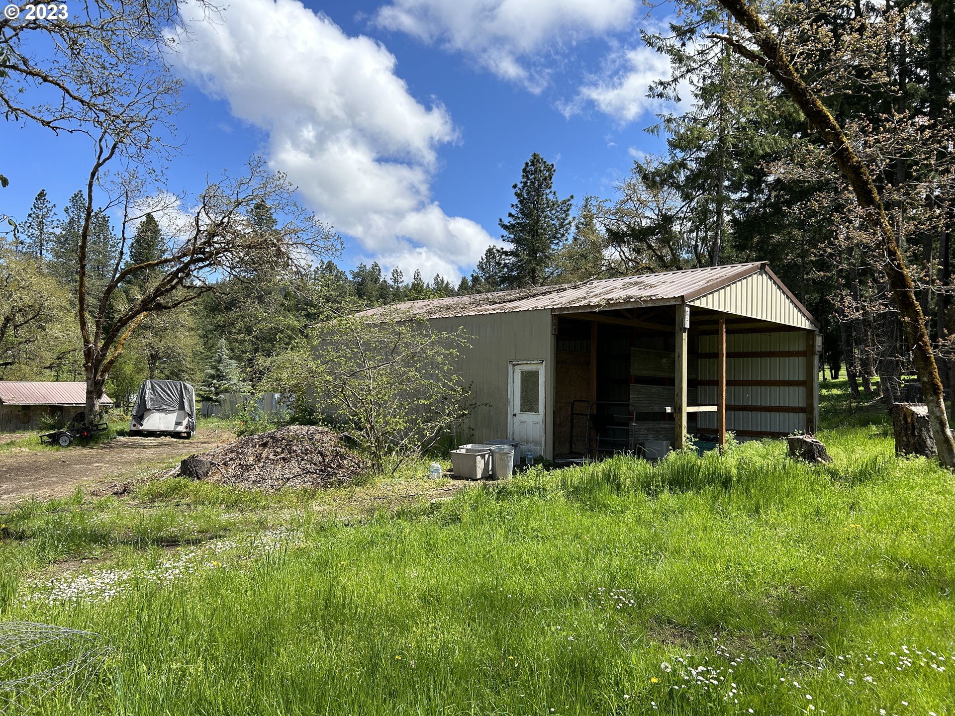 736 Byron Creek Road Winston, OR 97496 - Photo 5 of 19 a backyard of a house with lots of green space