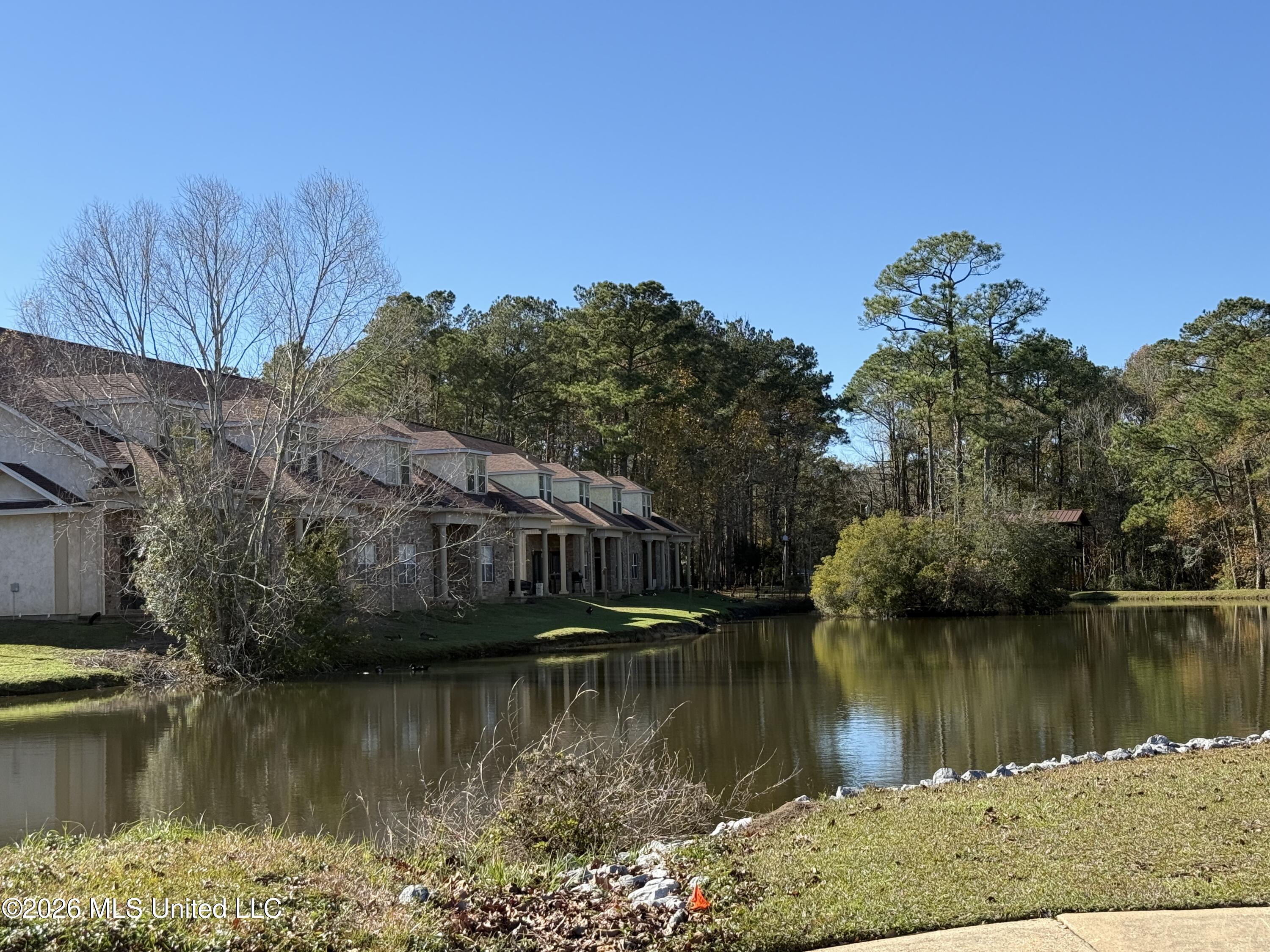 212 Capri Place, Unit 212 Ocean Springs, MS 39564 - Photo 10 of 44 Rear view