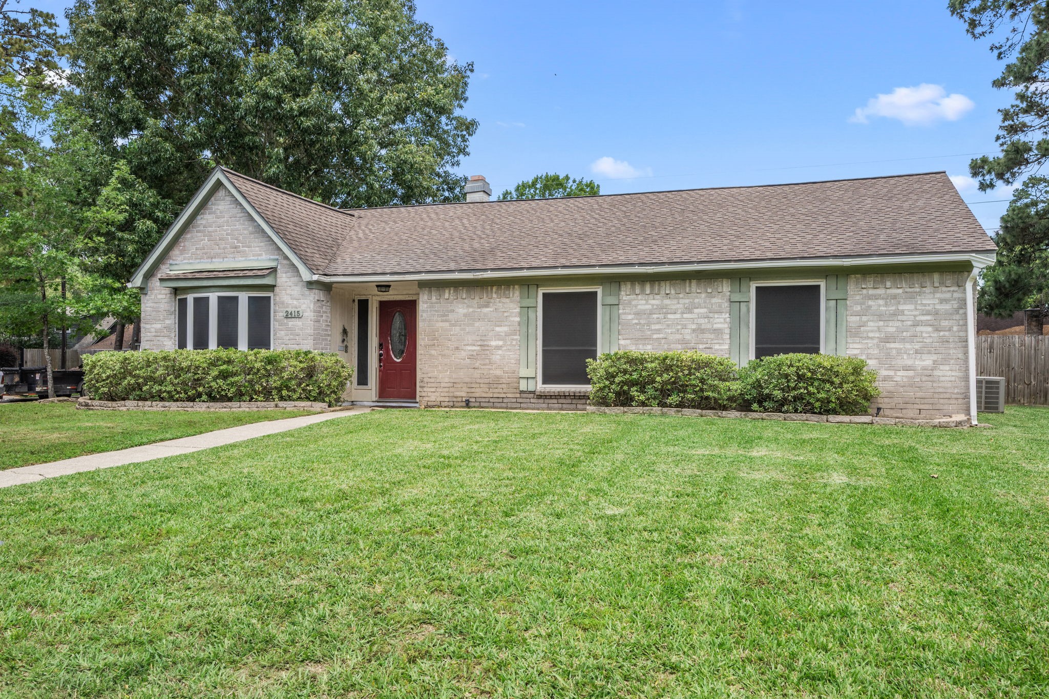 2415 Whispering Springs Drive Spring, TX 77373 - Photo 1 of 28 Oversized corner lot with a double-wide driveway and an additional covered workspace in the backyard, offering extra room for parking, projects, and storage