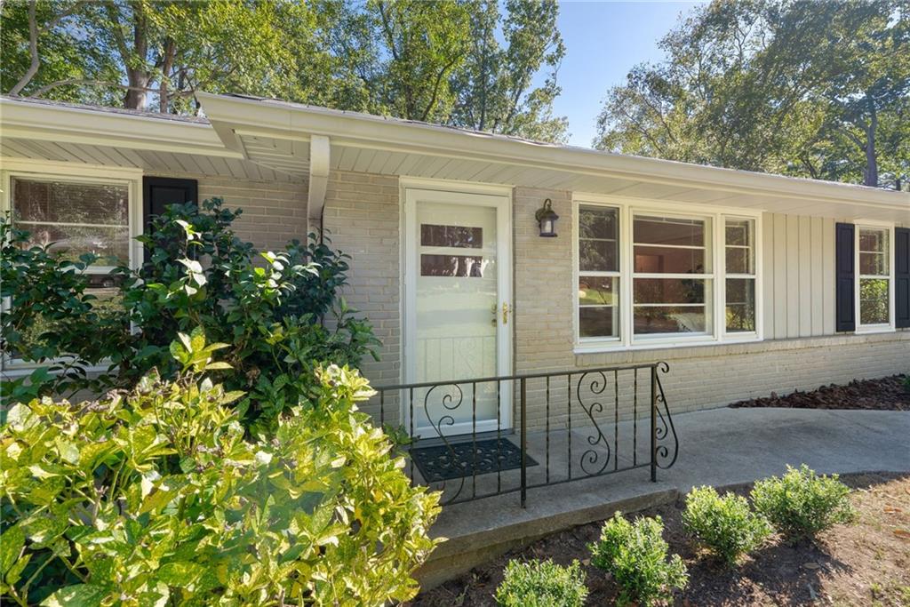 1183 Willivee Drive Decatur, GA 30033 - Photo 1 of 1 a view of a house with a flower garden